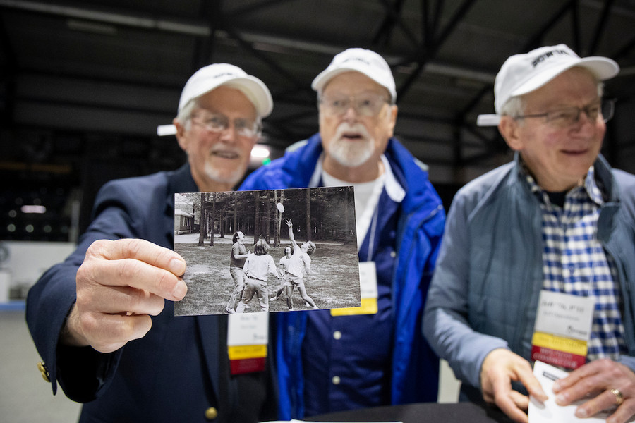 reunion image - alums with old photo